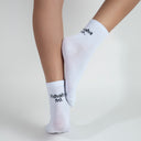 white socks with hahaha no. black text on top of the heel