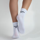 white socks with hahaha no. black text on top of the heel