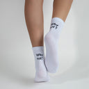 white socks with Why Not? black text on top of the heel
