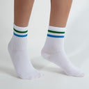 White crew socks with green-blue stripes